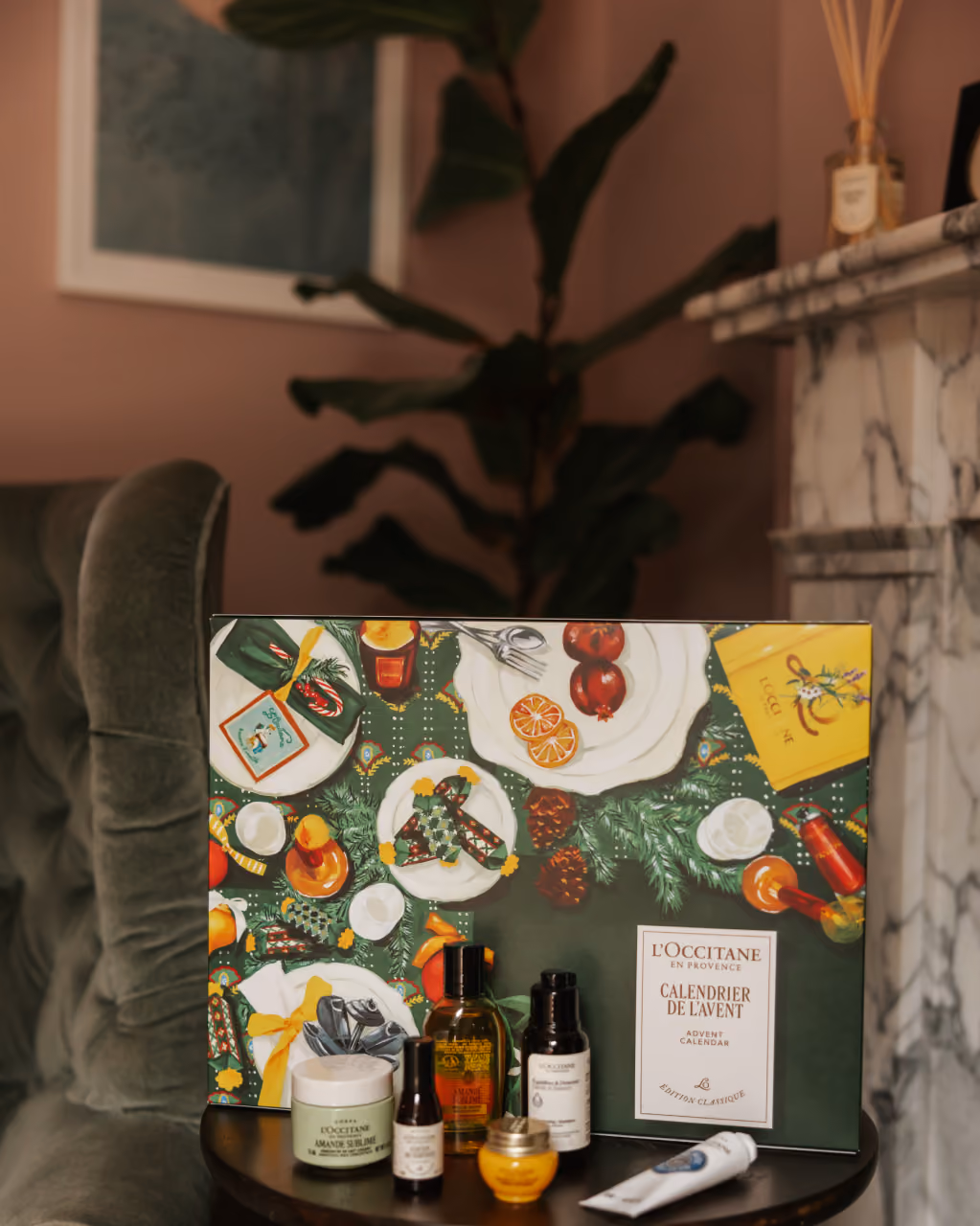 The box on a marble side table beside a chair, a few products in front