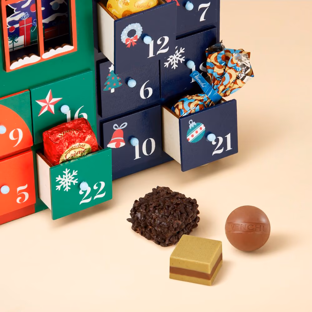 Open drawers close up with a crunchy cluster, a gianduja ball and a layered square
