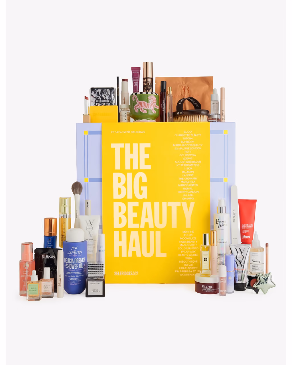 The yellow Big Beauty Haul box with the 40 products stacked on top of it and around its base