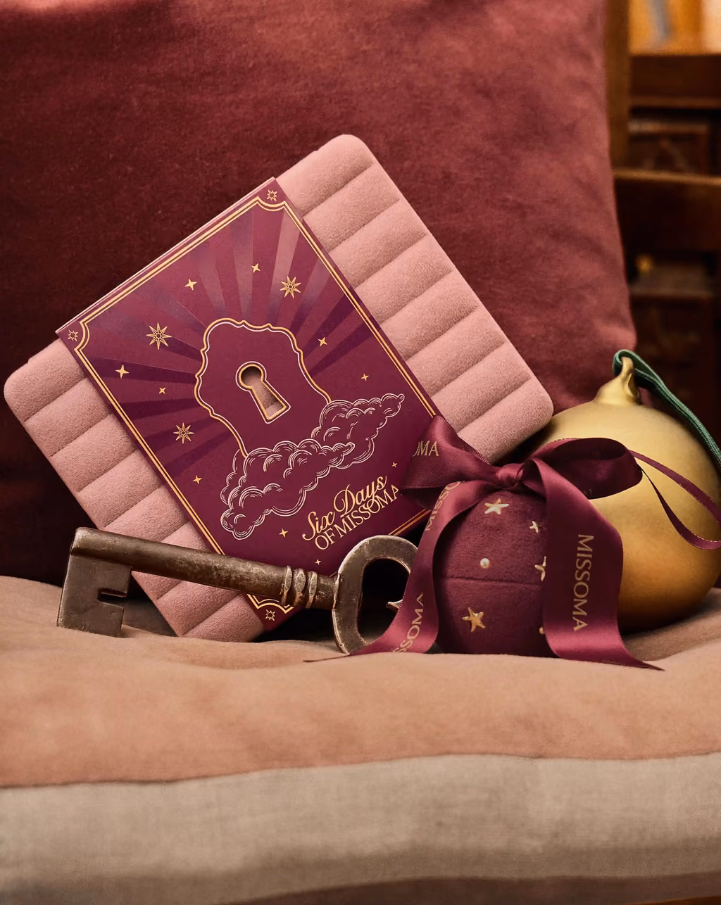 The velvet Missoma box open, its six numbered compartments and mirror lid showing