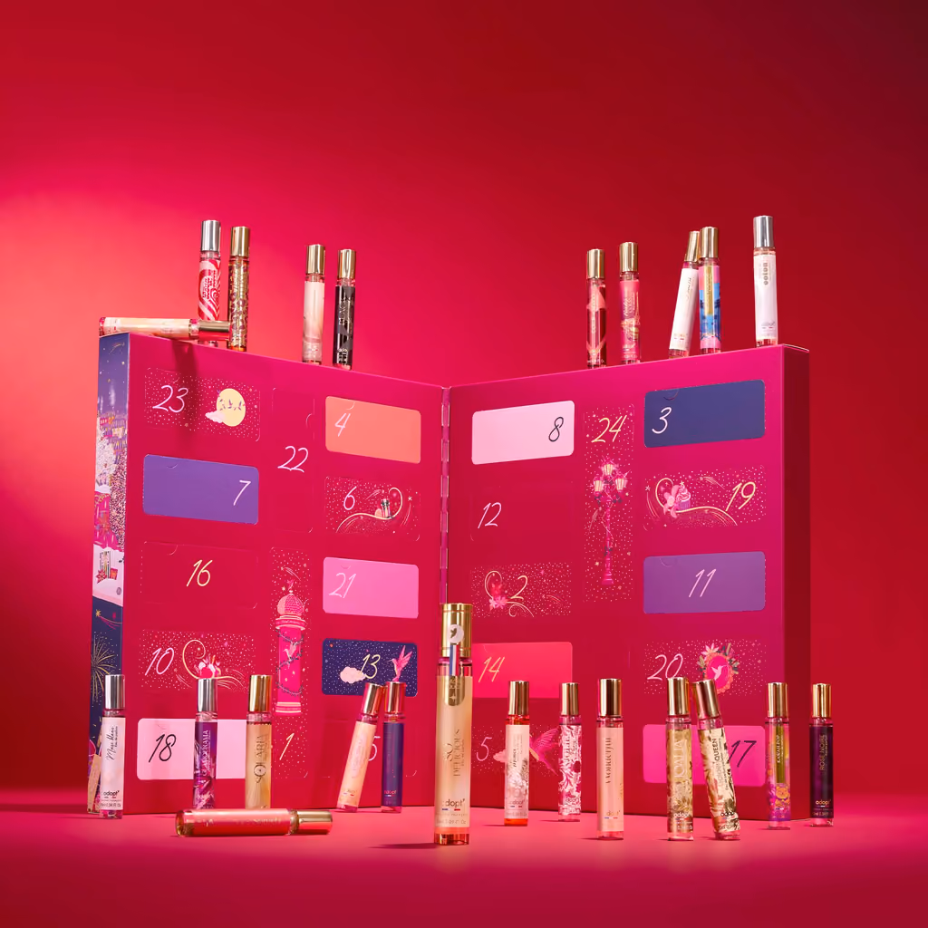 The open calendar with the perfume sprays standing in front of it