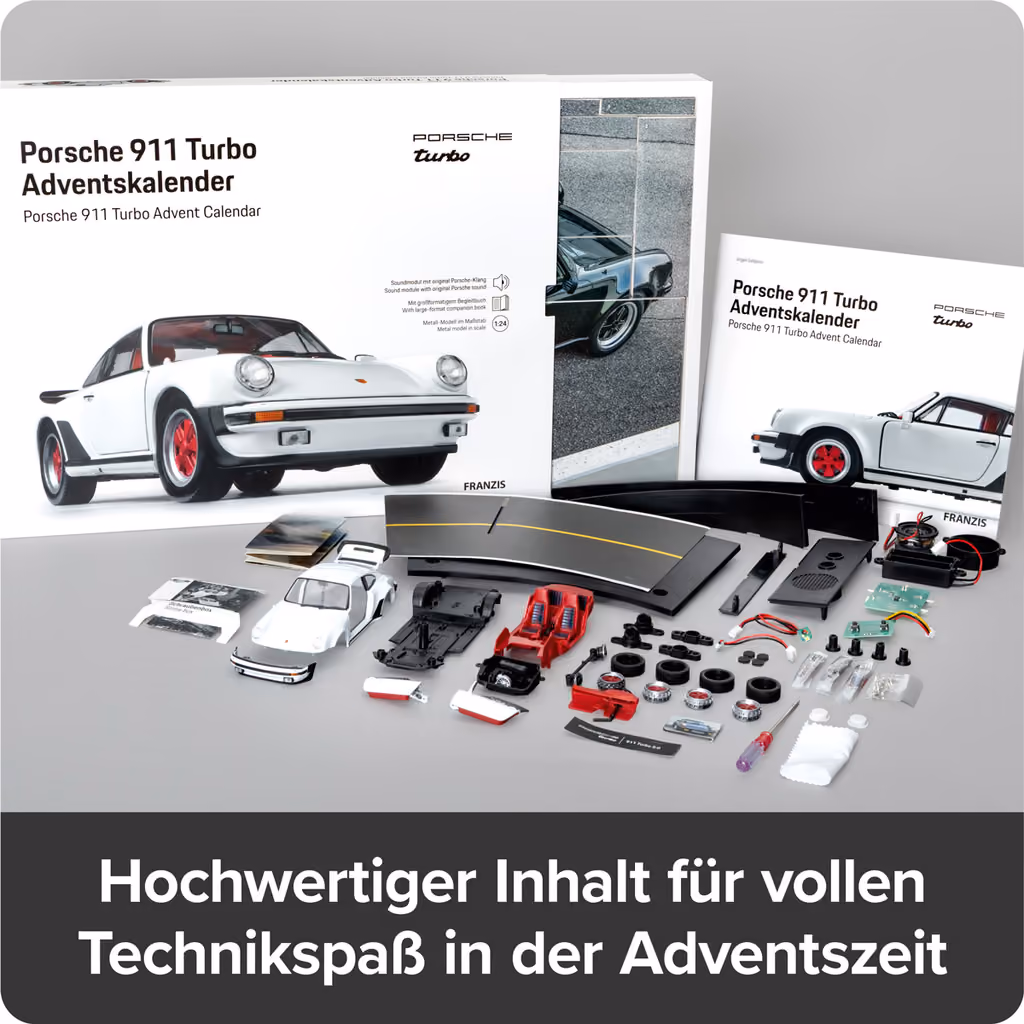 The model parts and the companion book laid out in front of the box