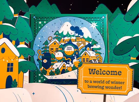The calendar standing open on a snowy set with its doors and a welcome sign