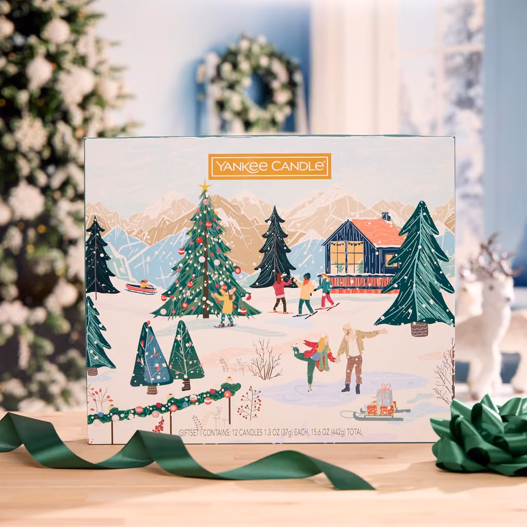 The closed box on a table beside a Christmas tree