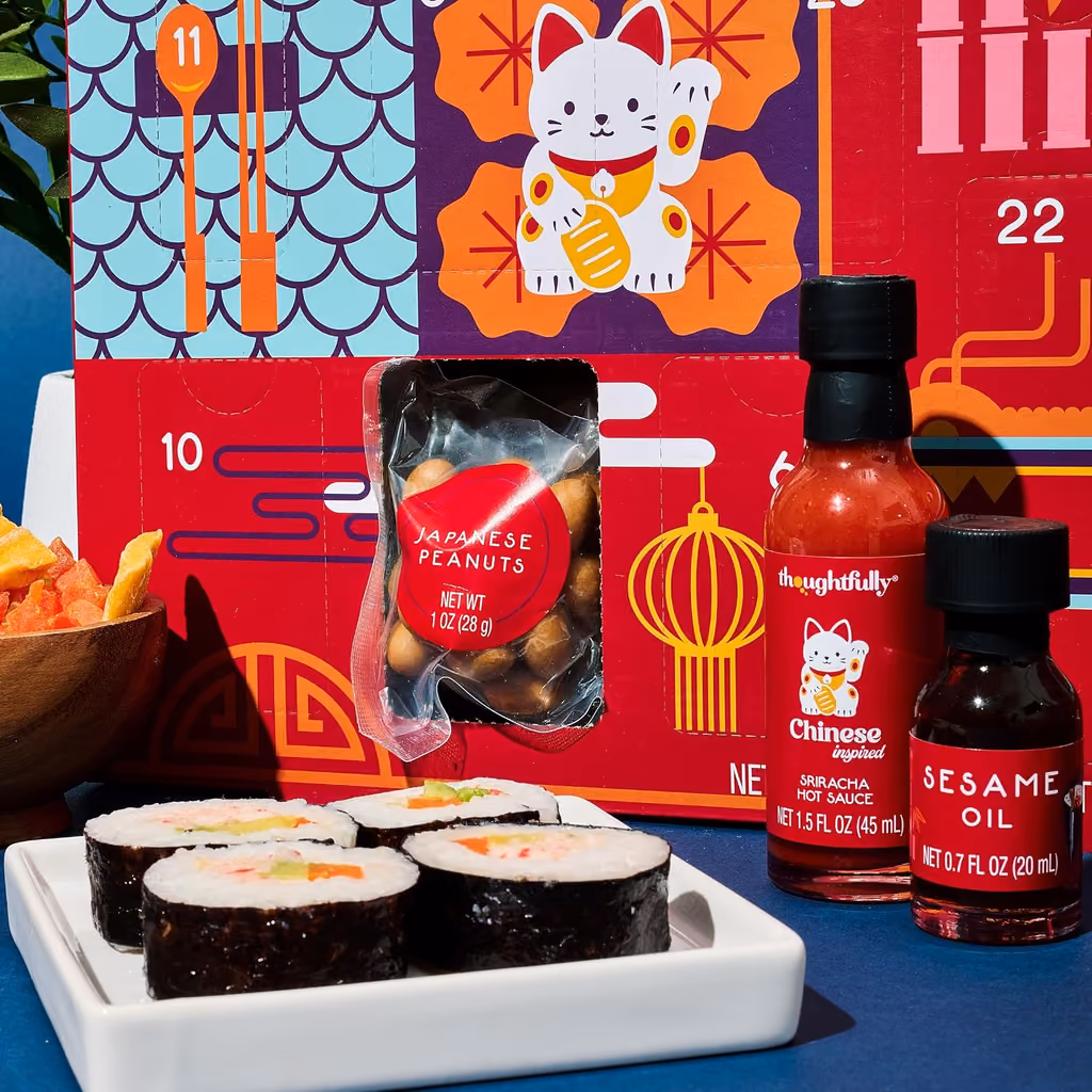 Close-up of sauces and Japanese peanuts beside the open box
