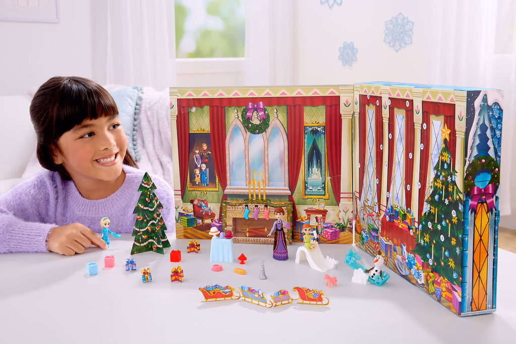 A child playing with the opened calendar, the doors folded out into the castle scene