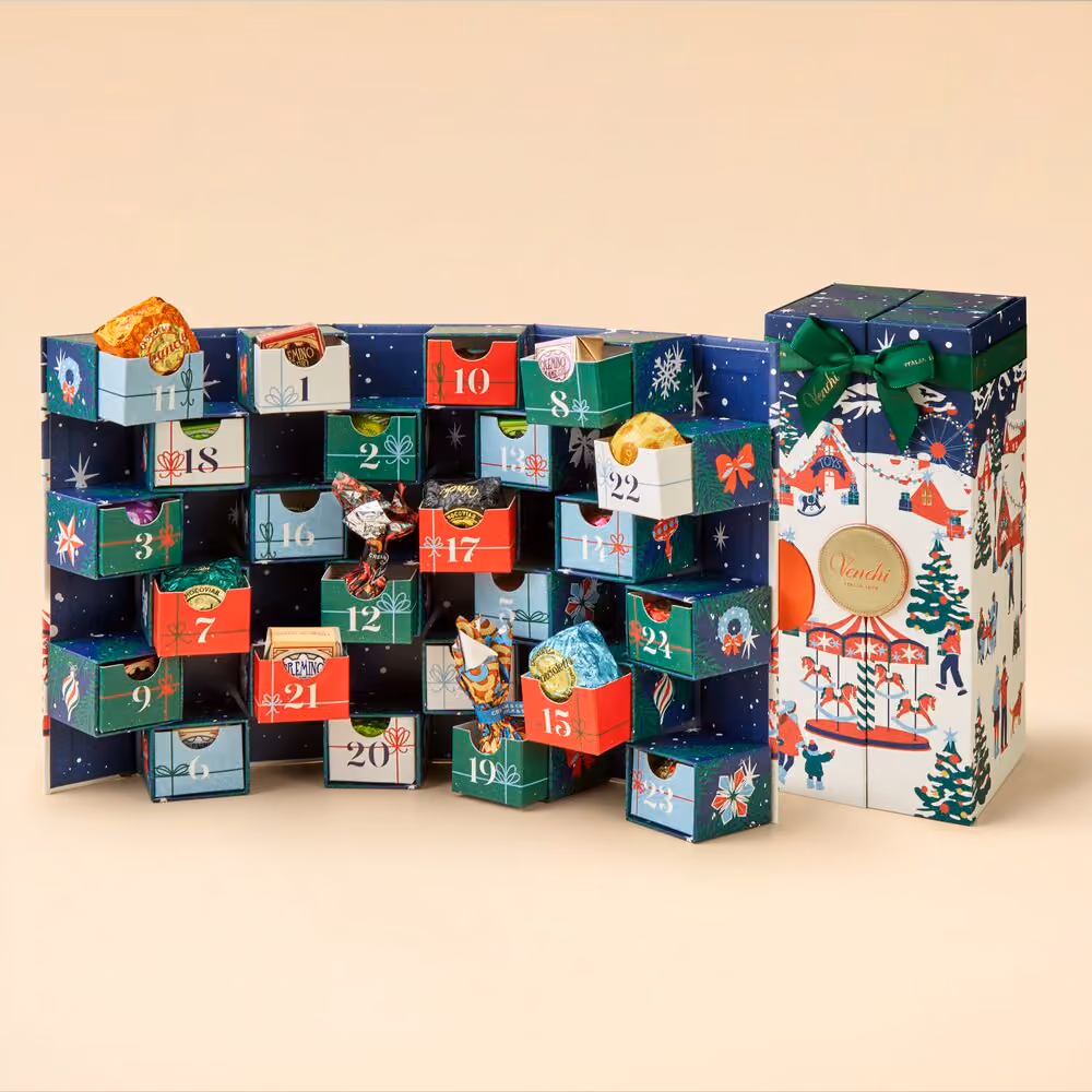 The chequerboard drawers pulled open with wrapped chocolates inside