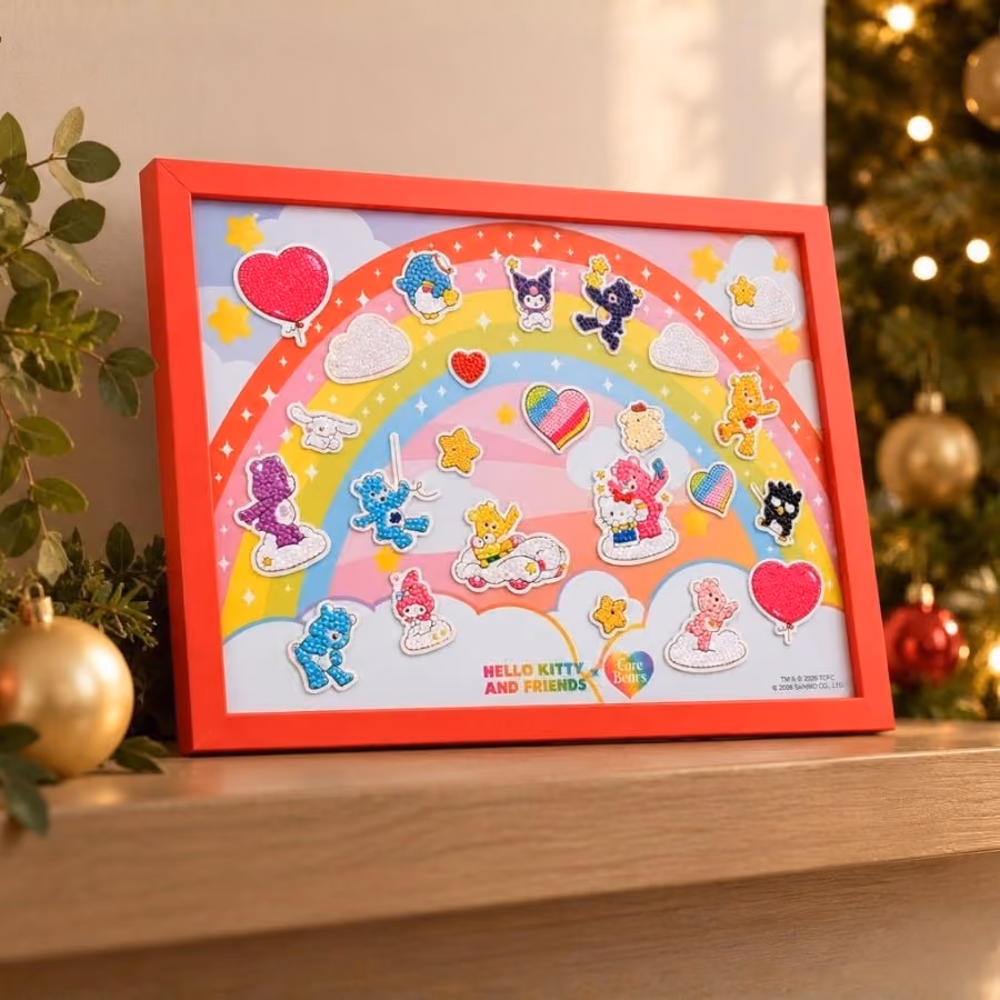 The framed board on a shelf beside a Christmas tree