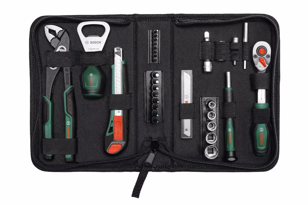 The Bosch 2026 box standing with the ratchet, pliers and sockets arranged in front