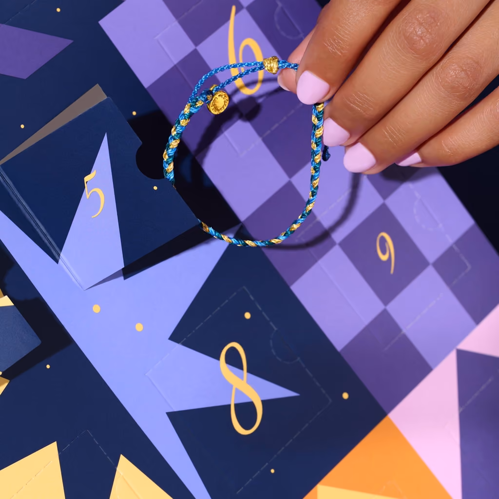 A blue and gold braided bracelet lifted from drawer 5