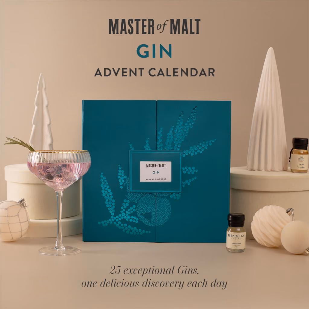 The closed box on a beige set with a gin glass and a dram