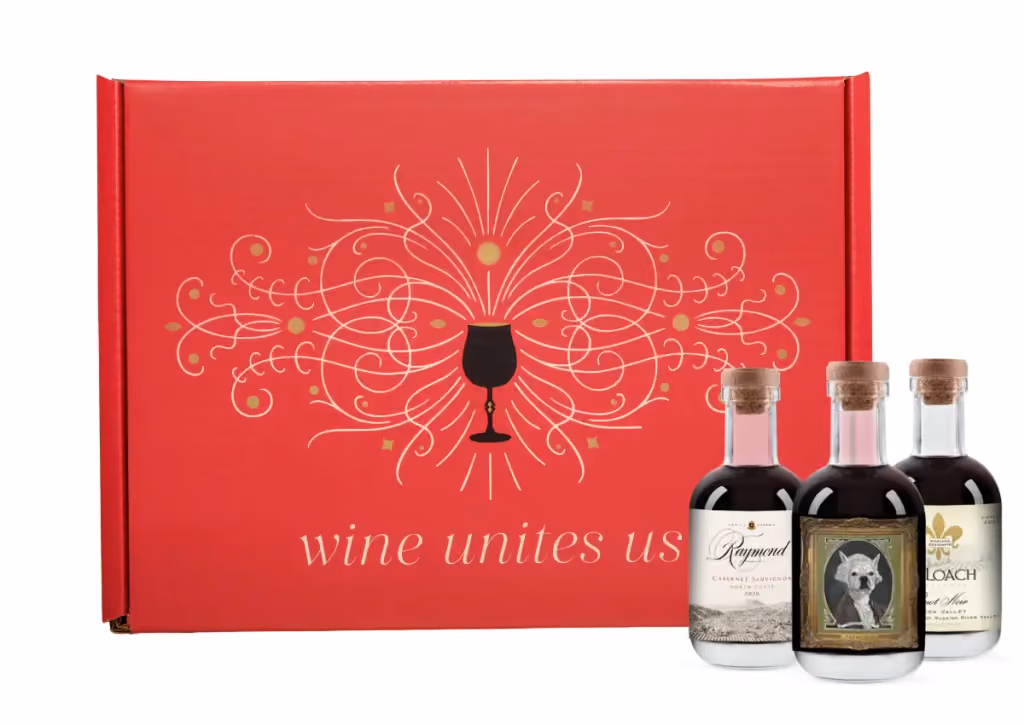The red box with three mini wine bottles standing at its side