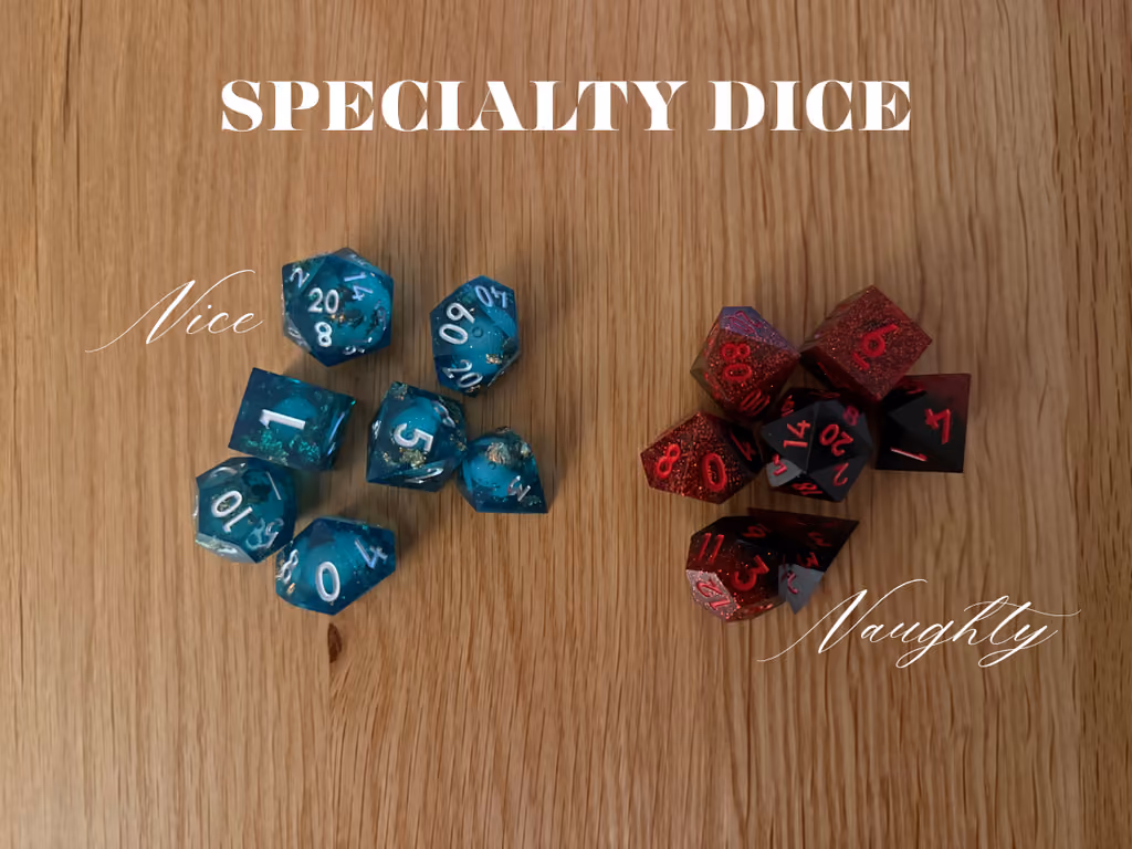 The teal Nice dice set beside the red Naughty one