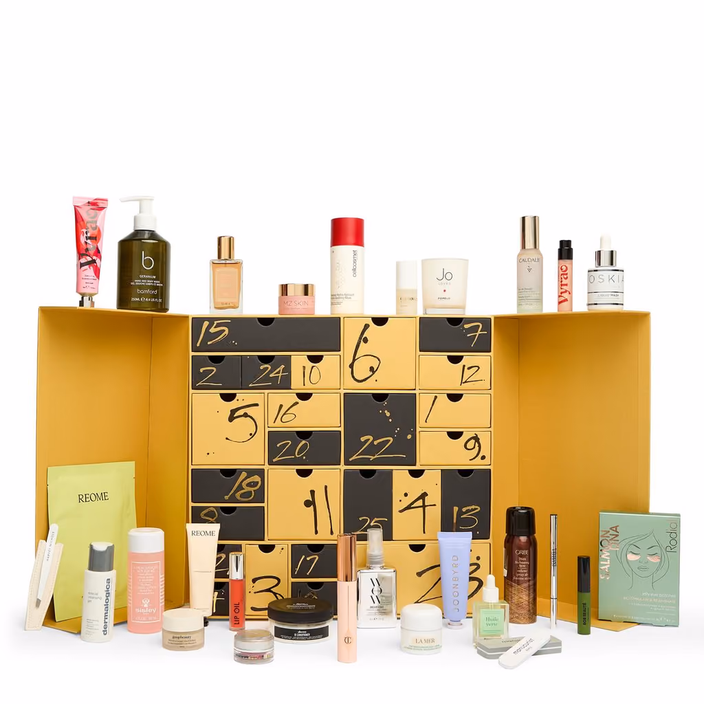 The open drawers with the 27 products standing in front and on top of the box