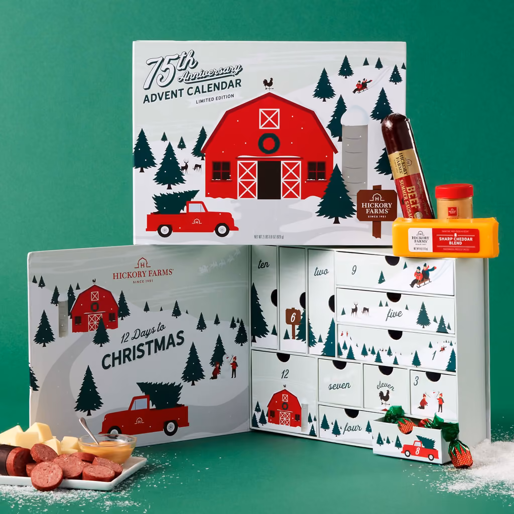 The box open on its twelve doors and drawers, sausage and cheese sliced in front
