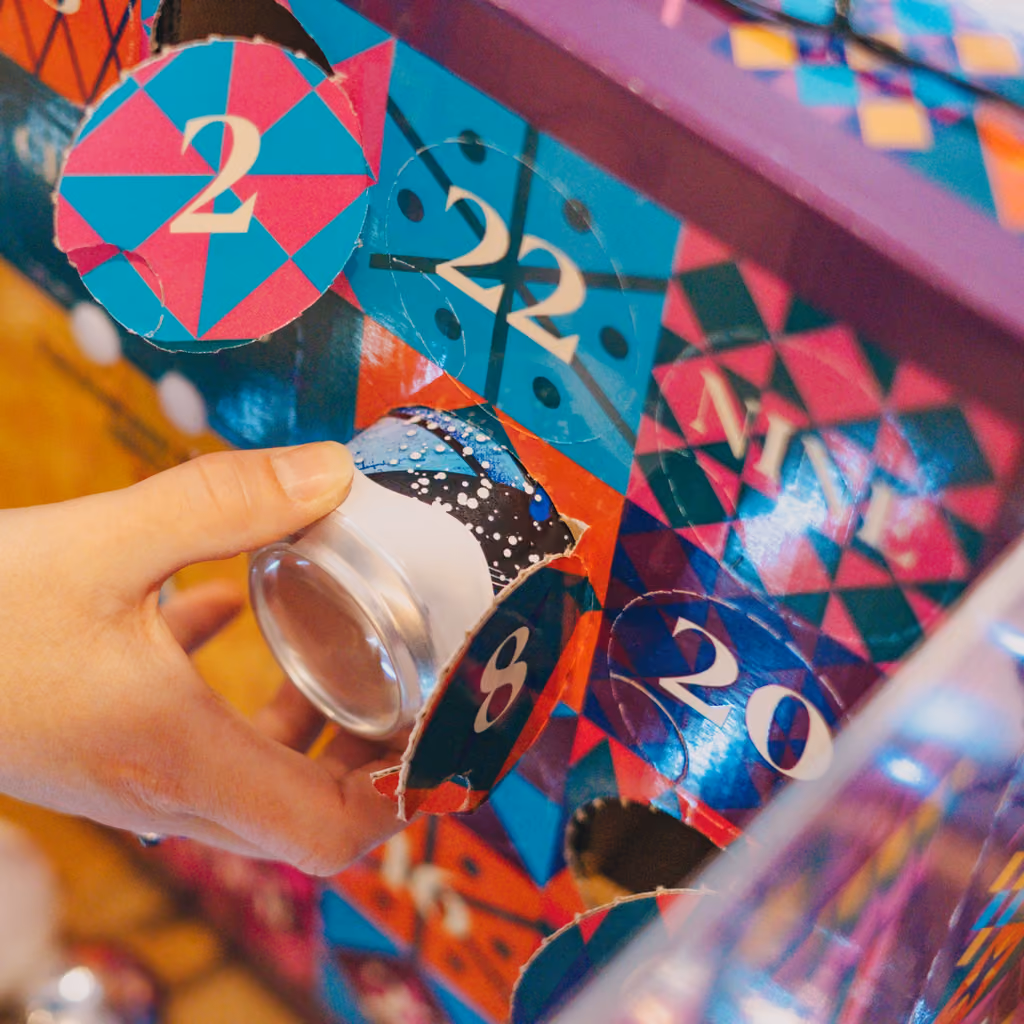 A hand pulling a can from a numbered door