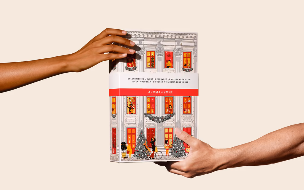 The closed townhouse box held between two hands