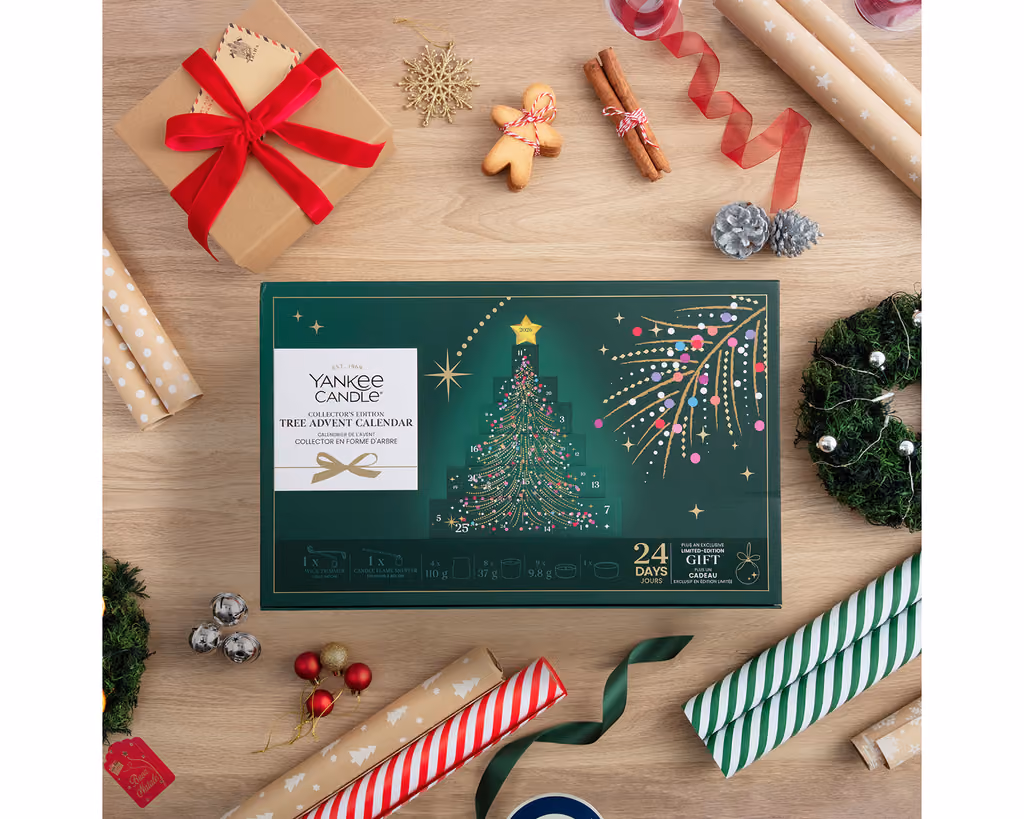 The carton on a wooden table among wrapping paper and gingerbread
