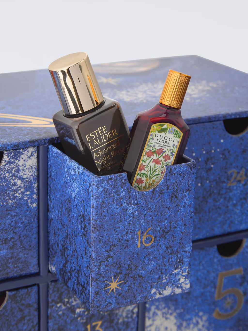 One drawer of the John Lewis 2026 box open, with the Estée Lauder and Gucci miniatures inside