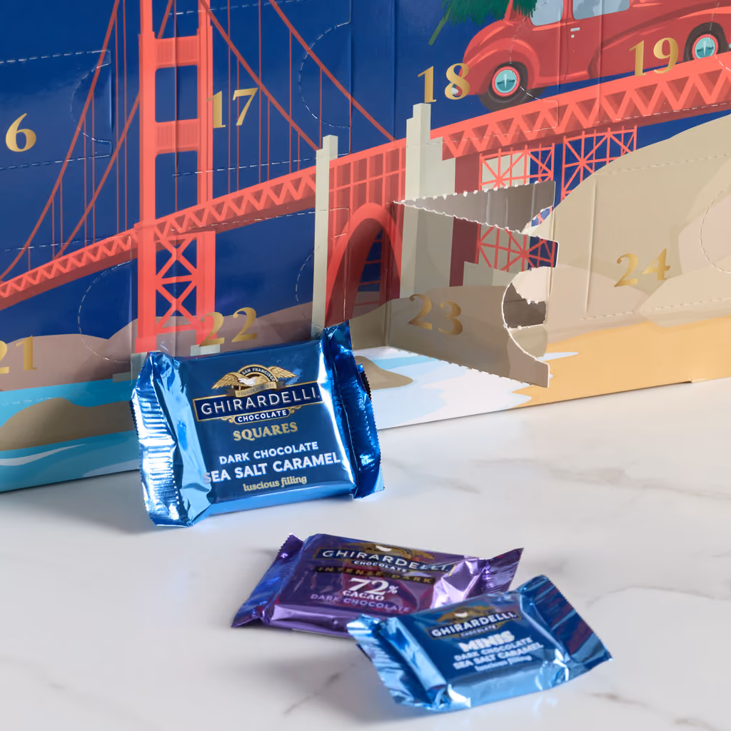 The box corner with the Golden Gate Bridge art and wrapped squares in front