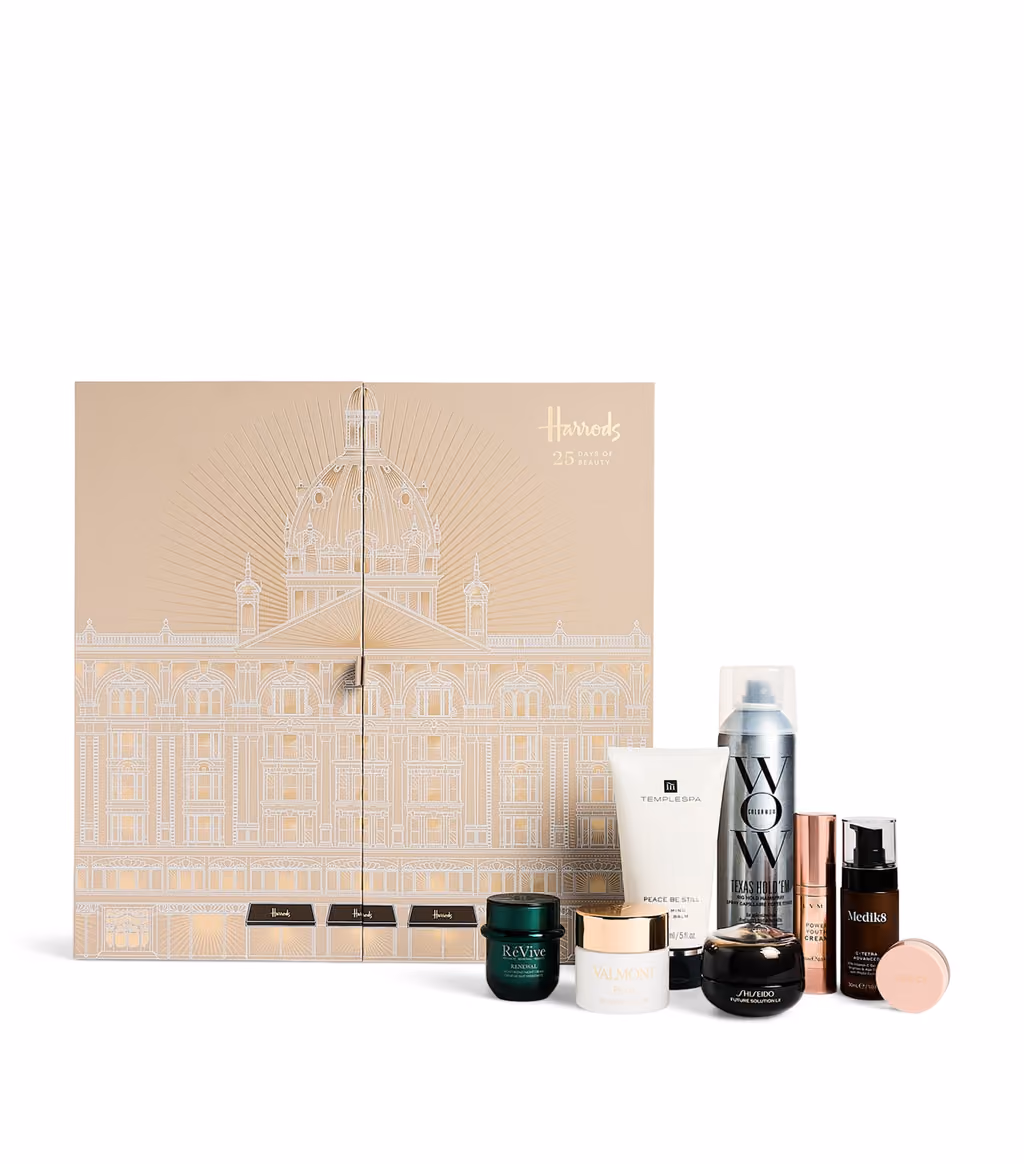The closed Harrods Beauty 2026 box with a handful of its skincare and hair products standing beside it