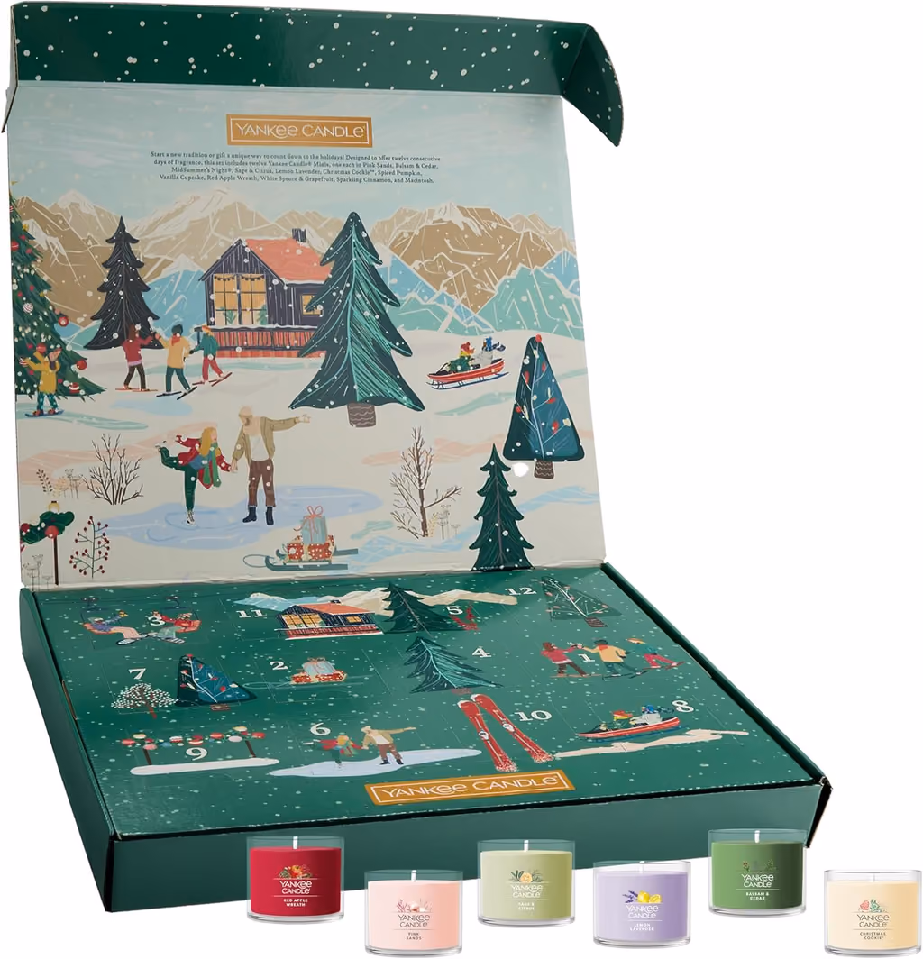 The open box with the lid up and four votives in front