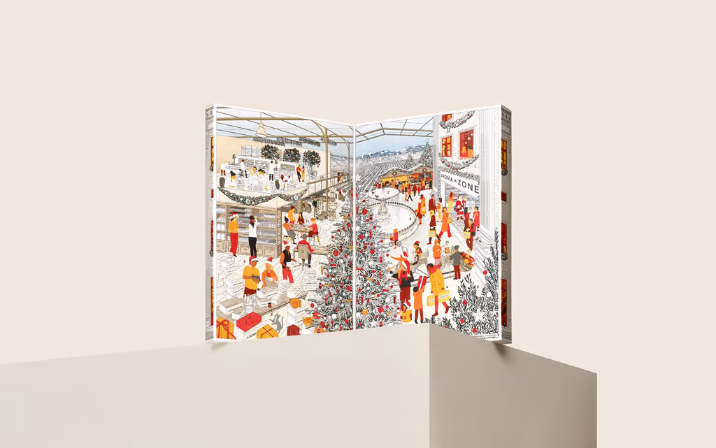 The box opened like a book onto an illustrated shop floor at Christmas