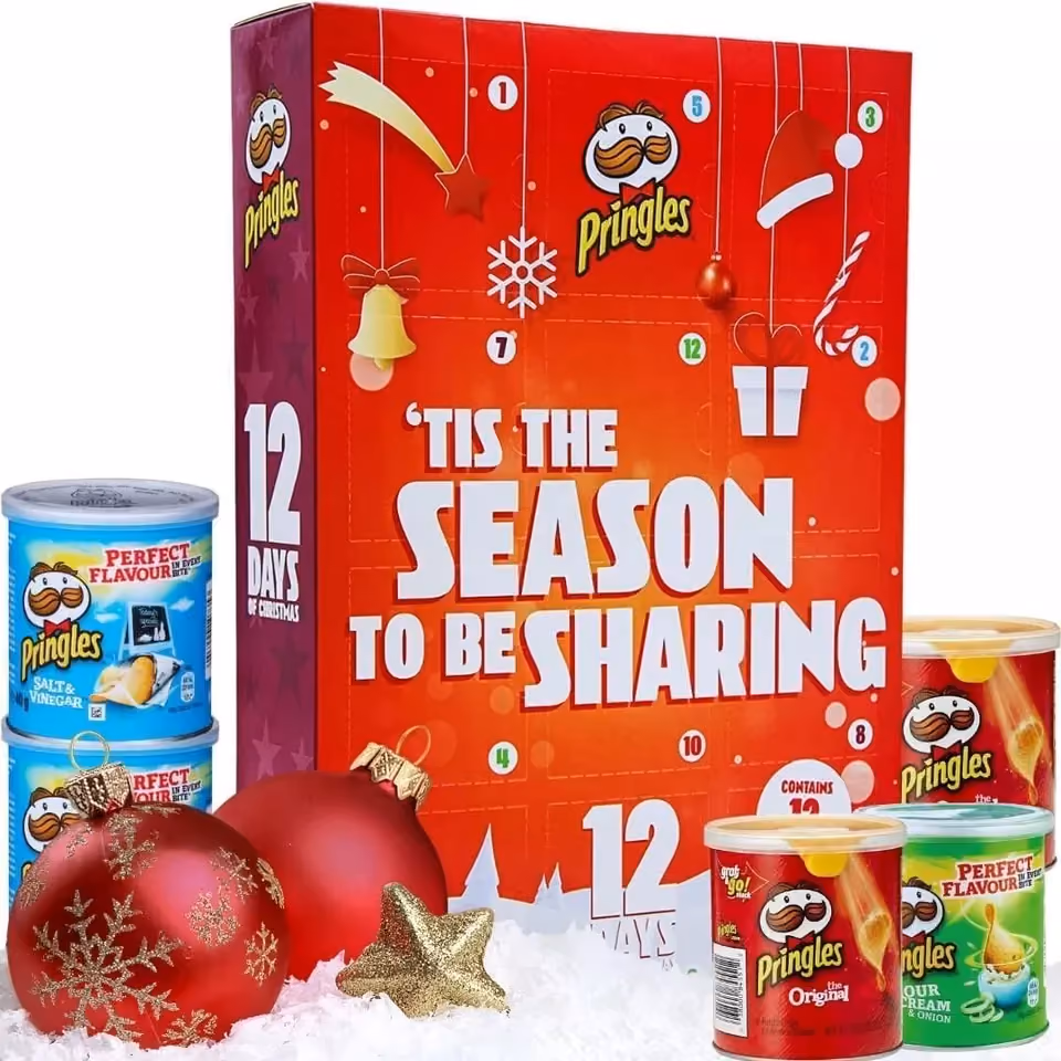 The calendar with the Pringles cans stacked around it on snow