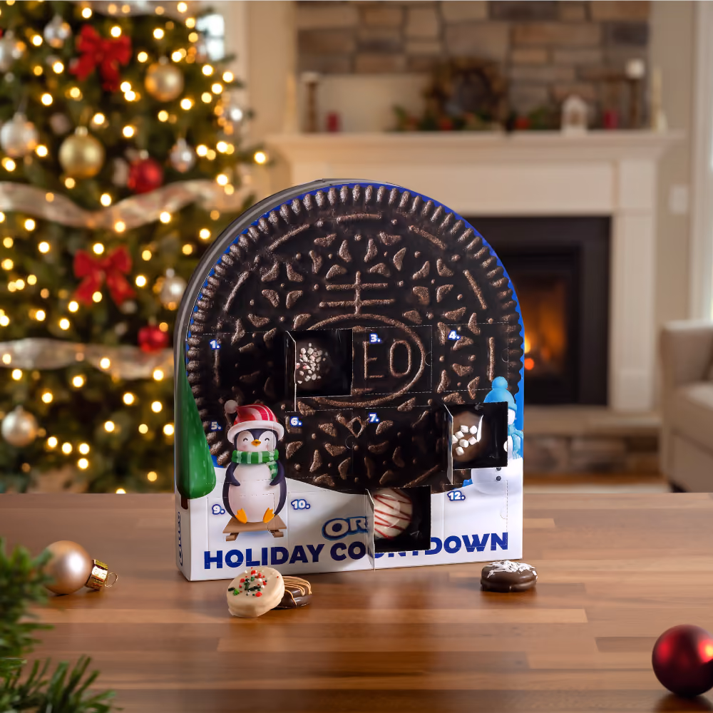 The OREO countdown box with its doors open on fudge-dipped cookies