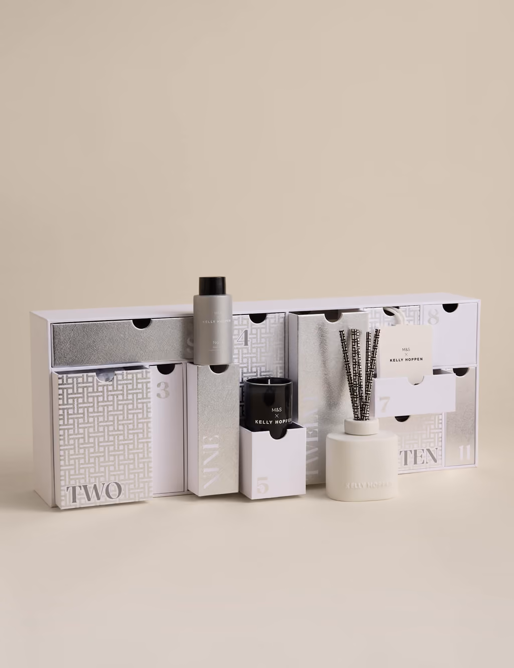 Every drawer open, a diffuser, candle and room spray standing in front