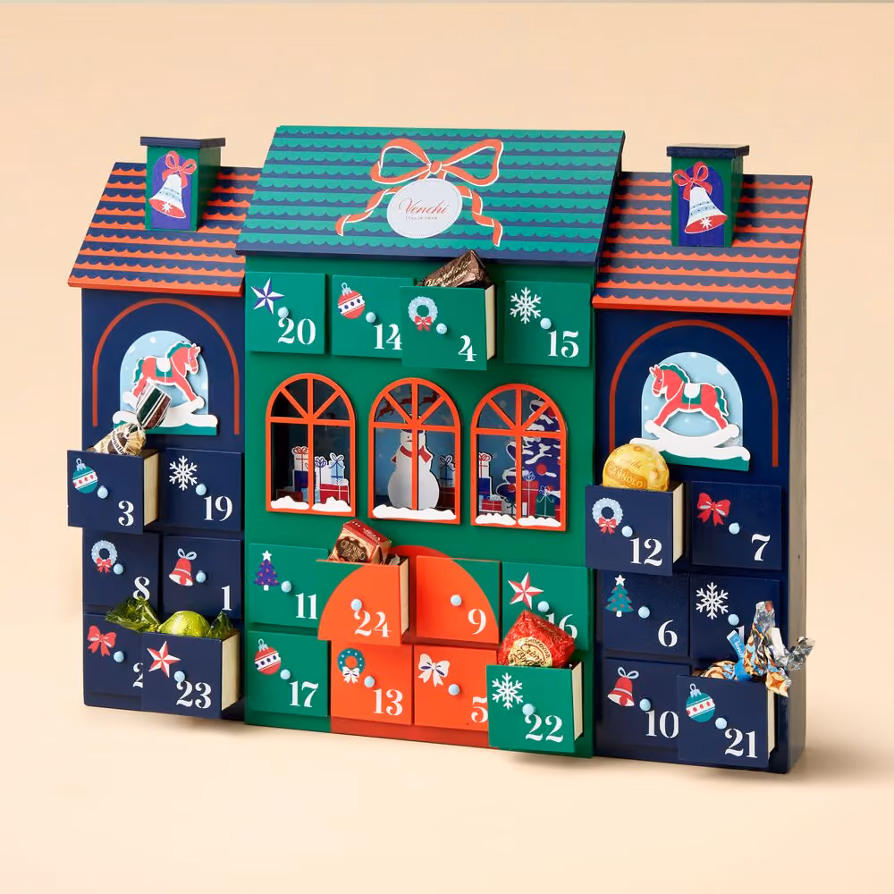The wooden house with drawers pulled open and chocolates showing