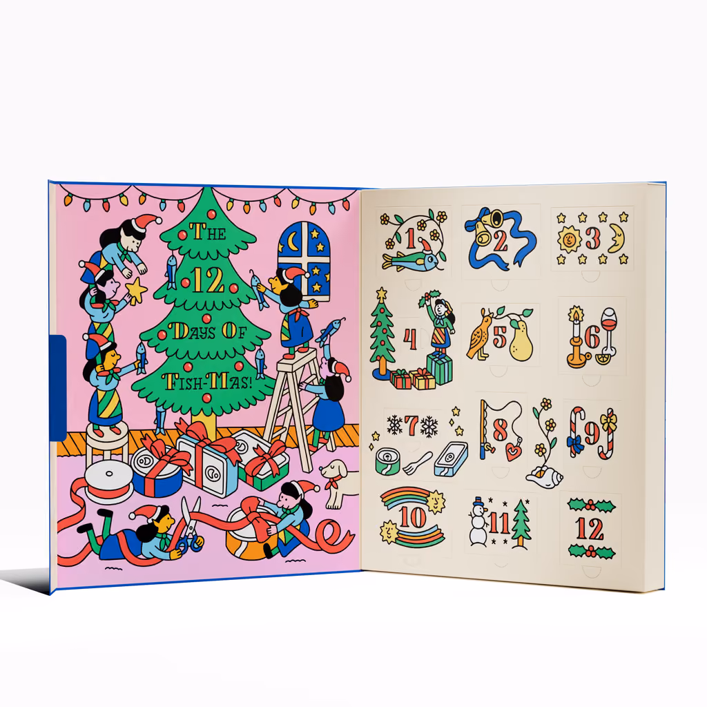 The box opened like a book, a Christmas tree scene on the left and twelve numbered doors on the right