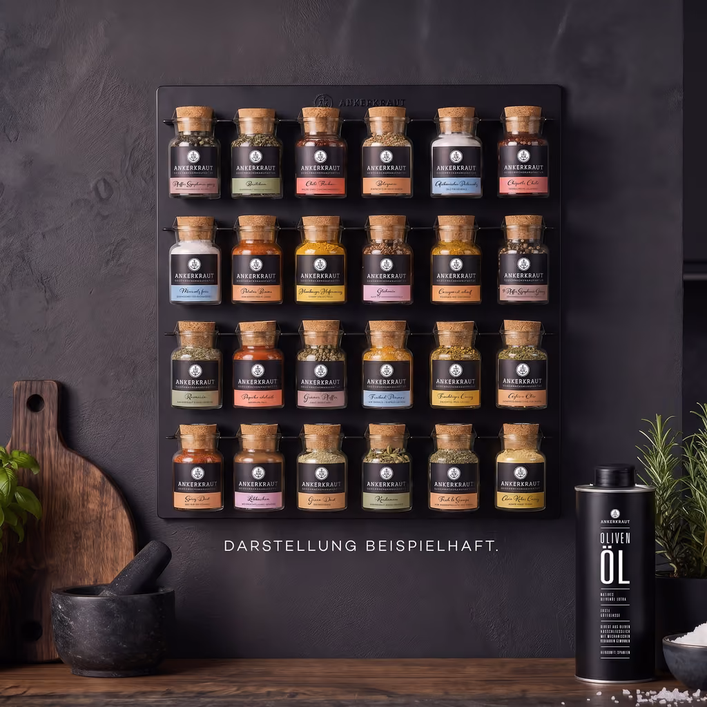 The wall rack filled with 24 Ankerkraut jars in a kitchen