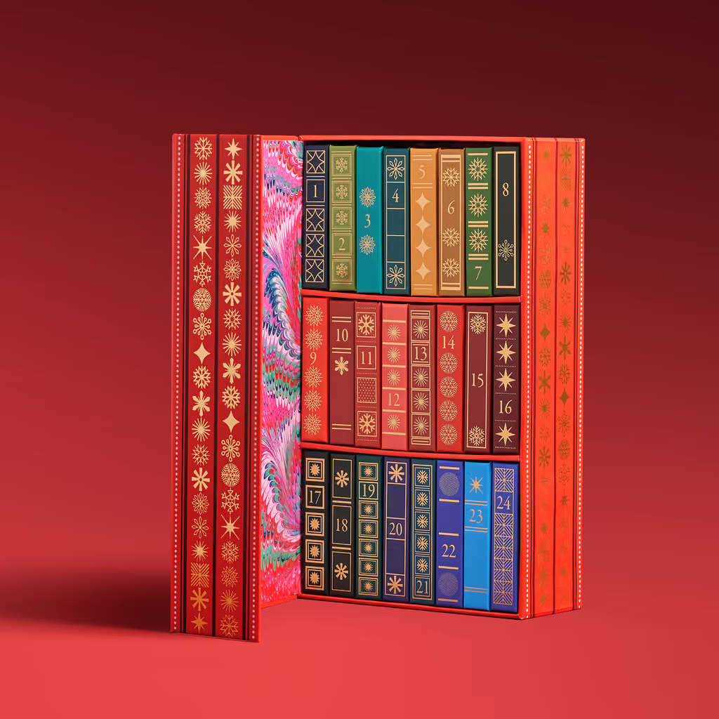 The slipcase standing beside a row of the 24 patterned miniature spines