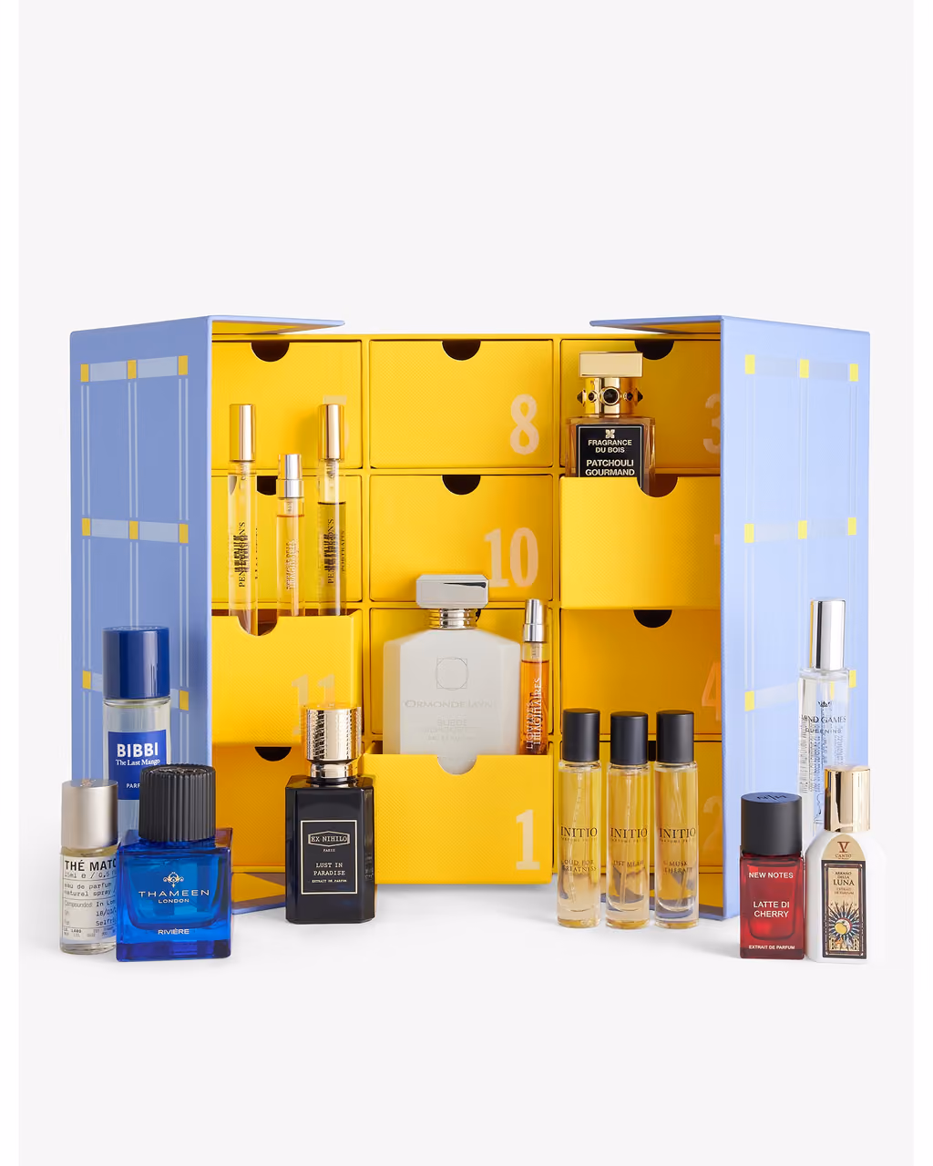 The box opened to its numbered yellow drawers on white, bottles in the trays and in front
